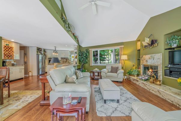 Fireplace, Interior, Kitchen, Living room, Pendant Lights, Recessed Lighting, Stainless Steel Appliances, Wood Texture Flooring