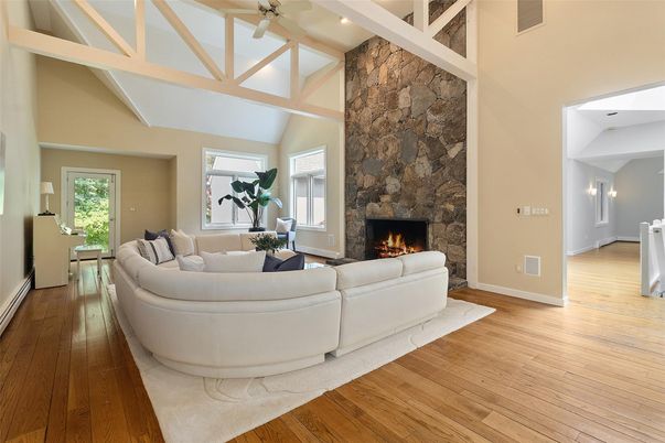 Fireplace, Interior, Living room, Recessed Lighting, Stone Walls, Wood Texture Flooring