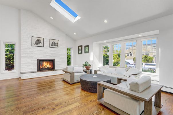 Fireplace, Interior, Living room, Recessed Lighting, Stone Walls, Wood Texture Flooring