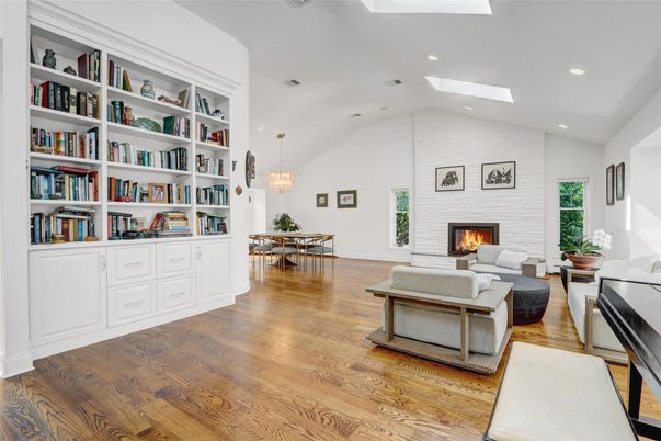 Chandelier, Dining room, Fireplace, Interior, Living room, Pendant Lights, Recessed Lighting, Wood Texture Flooring