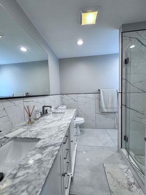 Bathroom, Dual Sink Vanities, Glass Shower, Interior, Marble, Marble Walls, Recessed Lighting