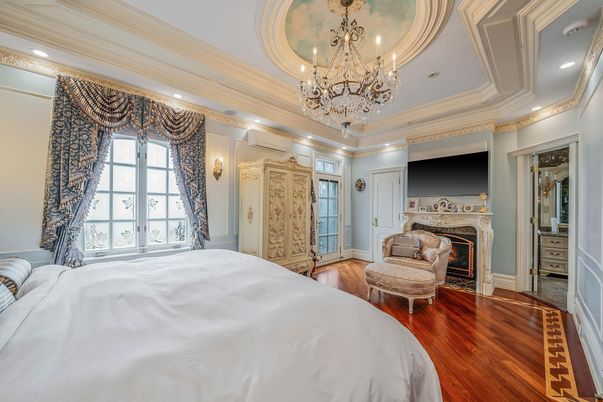 Bedroom, Chandelier, Fireplace, Interior, Recessed Lighting, Wood Texture Flooring