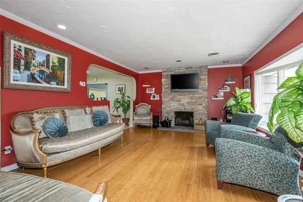 Fireplace, Interior, Living room, Recessed Lighting, Stone Walls, Wood Texture Flooring