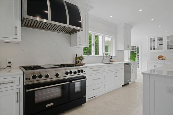Interior, Kitchen, Marble Walls, Recessed Lighting, Stainless Steel Appliances