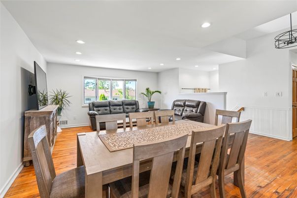 Dining room, Fireplace, Interior, Living room, Recessed Lighting, Wood Texture Flooring