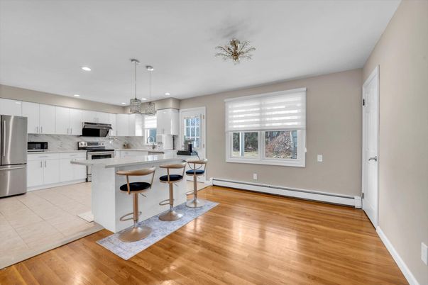 Interior, Kitchen, Marble Walls, Pendant Lights, Recessed Lighting, Stainless Steel Appliances, Wood Texture Flooring