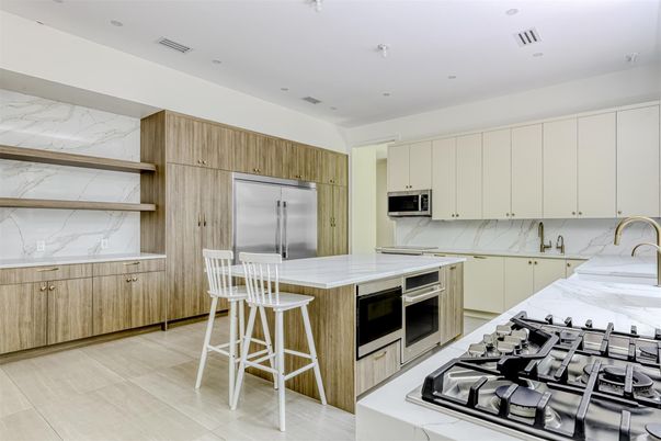 Interior, Kitchen, Marble Walls, Recessed Lighting, Stainless Steel Appliances