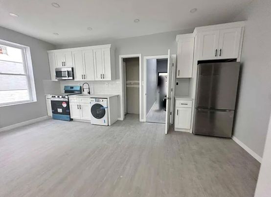 Interior, Kitchen, Recessed Lighting, Washer, Wood Texture Flooring