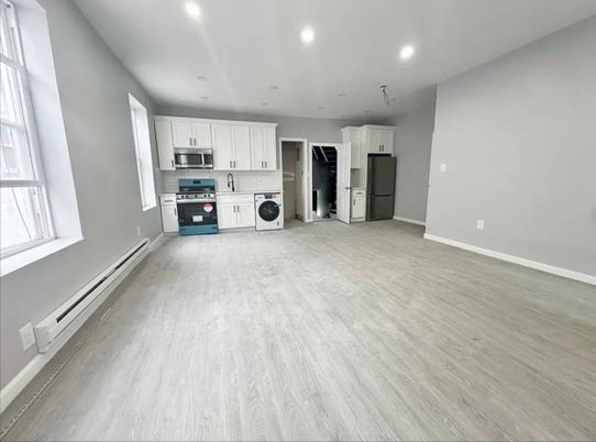 Interior, Kitchen, Recessed Lighting, Stainless Steel Appliances, Washer, Wood Texture Flooring