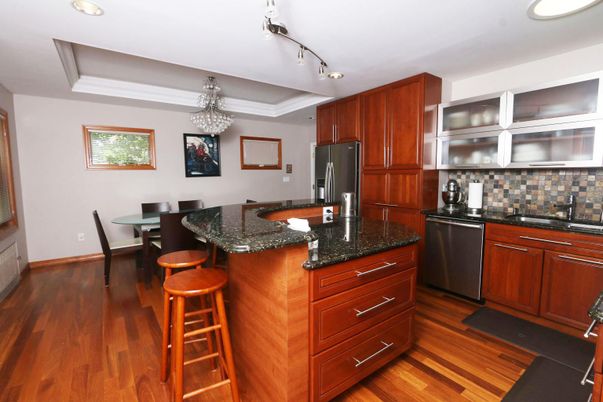 Chandelier, Dining room, Interior, Kitchen, Recessed Lighting, Stainless Steel Appliances, Wood Texture Flooring