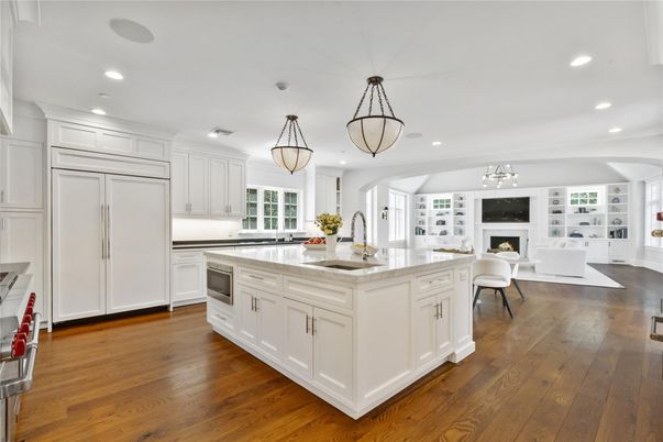 Chandelier, Fireplace, Interior, Kitchen, Living room, Pendant Lights, Recessed Lighting, Wood Texture Flooring