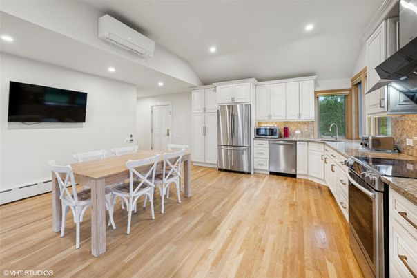Dining room, Interior, Kitchen, Recessed Lighting, Stainless Steel Appliances, Wood Texture Flooring