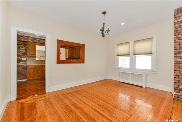 Chandelier, Empty room, Interior, Recessed Lighting, Stone Walls, Wood Texture Flooring
