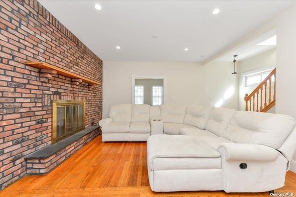 Fireplace, Interior, Living room, Recessed Lighting, Stone Walls, Wood Texture Flooring