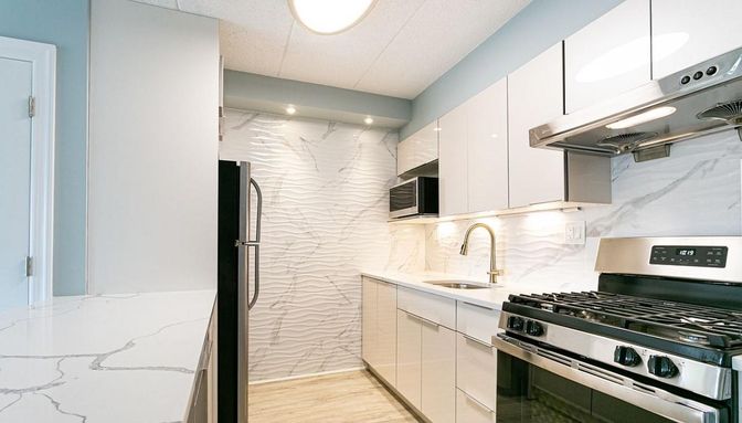 Interior, Kitchen, Marble Walls, Recessed Lighting, Stainless Steel Appliances, Wood Texture Flooring