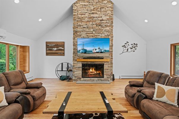 Fireplace, Interior, Living room, Recessed Lighting, Stone Walls, Wood Texture Flooring