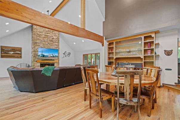 Dining room, Fireplace, Interior, Living room, Recessed Lighting, Stone Walls, Wooden Beams, Wood Texture Flooring