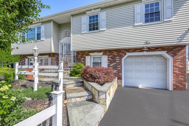 Attached, Exterior, Facade, Brick Facade, Raised Ranch