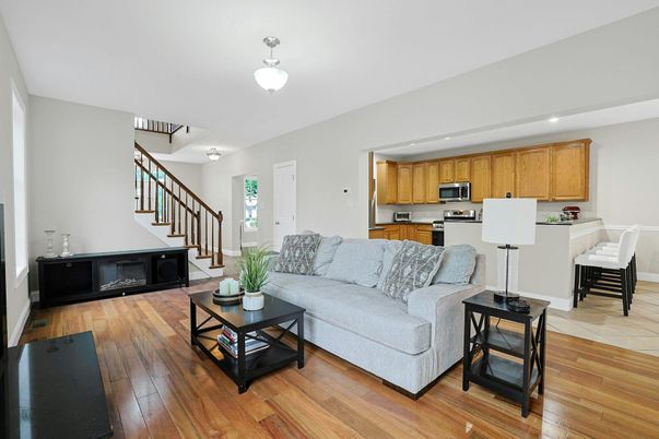 Dining room, Fireplace, Interior, Kitchen, Living room, Recessed Lighting, Stainless Steel Appliances, Wood Texture Flooring