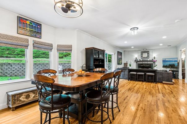 Dining room, Fireplace, Interior, Living room, Recessed Lighting, Wood Texture Flooring