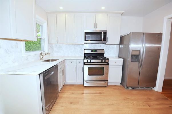 Interior, Kitchen, Recessed Lighting, Stainless Steel Appliances, Wood Texture Flooring