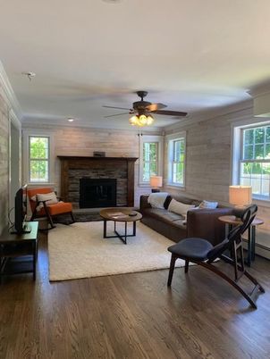Fireplace, Interior, Living room, Recessed Lighting, Stone Walls, Wood Texture Flooring