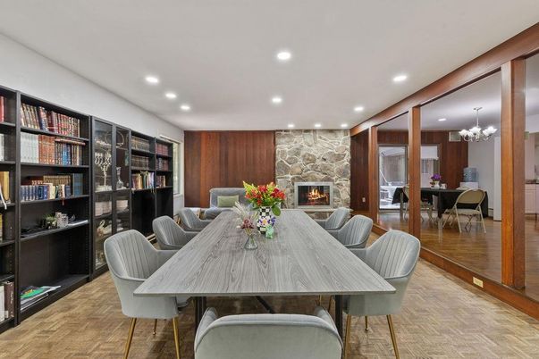 Chandelier, Dining room, Fireplace, Interior, Recessed Lighting, Stone Walls, Wood Texture Flooring