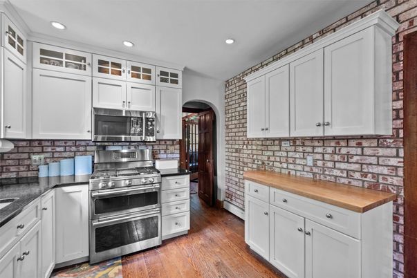 Interior, Kitchen, Recessed Lighting, Stainless Steel Appliances, Stone Walls, Wood Texture Flooring