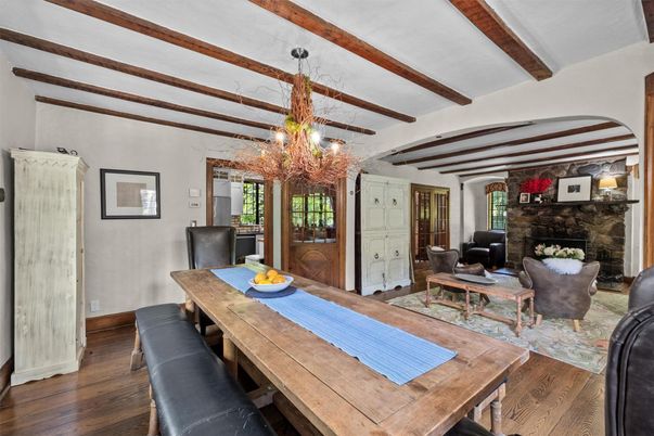 Chandelier, Dining room, Fireplace, Interior, Living room, Stone Walls, Wooden Beams, Wood Texture Flooring