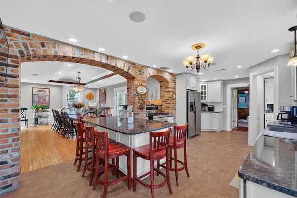Chandelier, Dining room, Interior, Kitchen, Pendant Lights, Recessed Lighting, Stone Walls, Wood Texture Flooring