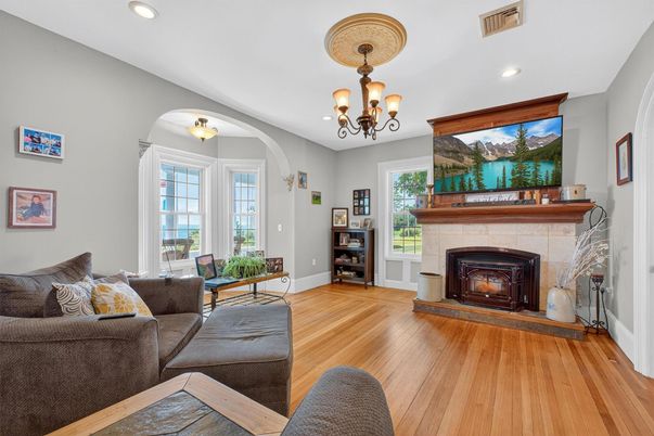 Chandelier, Fireplace, Interior, Living room, Recessed Lighting, Wood Texture Flooring