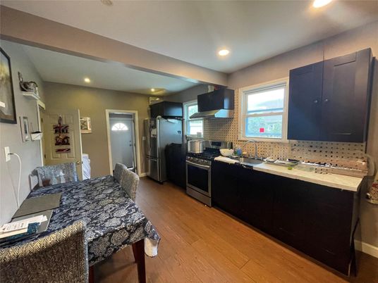 Dining room, Interior, Kitchen, Recessed Lighting, Stainless Steel Appliances, Wood Texture Flooring