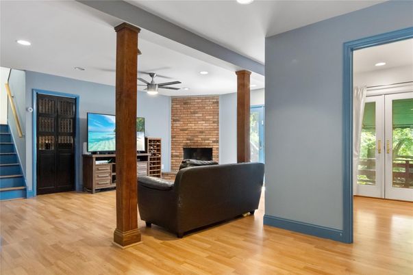 Fireplace, Interior, Living room, Recessed Lighting, Stone Walls, Wood Texture Flooring