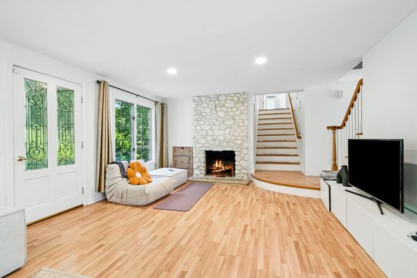 Fireplace, Interior, Living room, Recessed Lighting, Stone Walls, Wood Texture Flooring