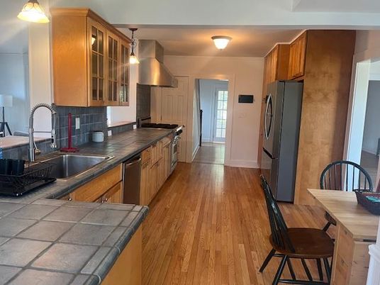 Interior, Kitchen, Pendant Lights, Tile Countertops, Wood Texture Flooring