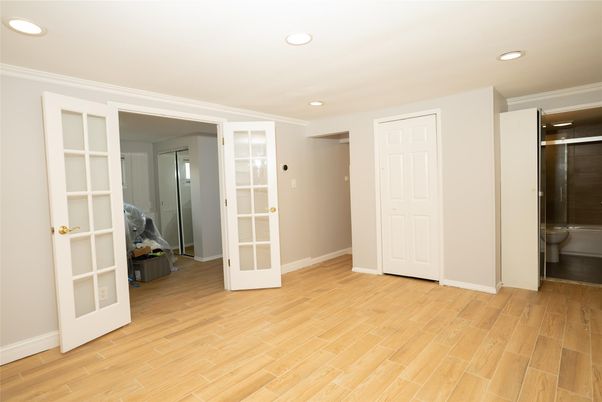Bathroom, Empty room, Glass Shower, Interior, Recessed Lighting, Wood Texture Flooring