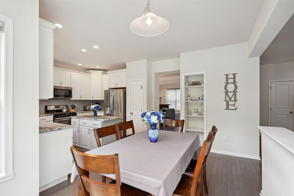Dining room, Interior, Kitchen, Pendant Lights, Recessed Lighting, Stainless Steel Appliances, Wood Texture Flooring