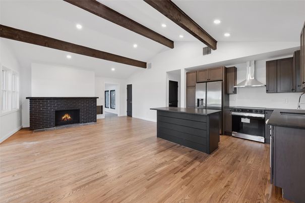 Fireplace, Interior, Kitchen, Recessed Lighting, Stainless Steel Appliances, Wooden Beams, Wood Texture Flooring
