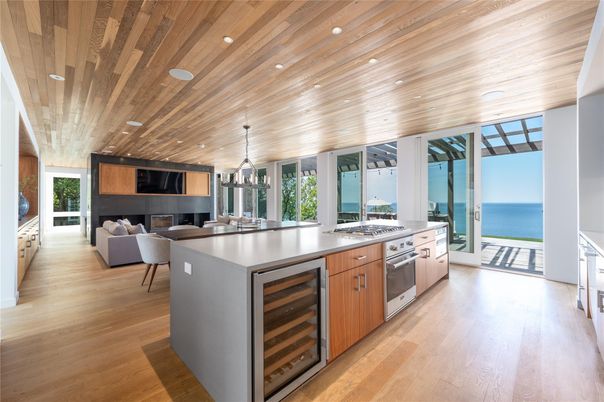 Dining room, Fireplace, Interior, Kitchen, Living room, Pendant Lights, Recessed Lighting, Stainless Steel Appliances, Water, Wooden Ceilings, Wood Texture Flooring