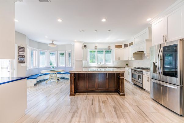 Dining room, Interior, Kitchen, Pendant Lights, Recessed Lighting, Stainless Steel Appliances, Wood Texture Flooring