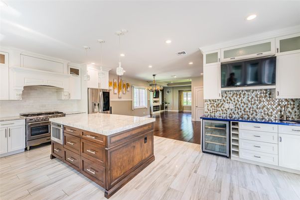 Chandelier, Interior, Kitchen, Pendant Lights, Recessed Lighting, Stainless Steel Appliances, Wood Texture Flooring