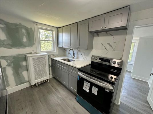 Interior, Kitchen, Marble Walls, Stainless Steel Appliances, Wood Texture Flooring