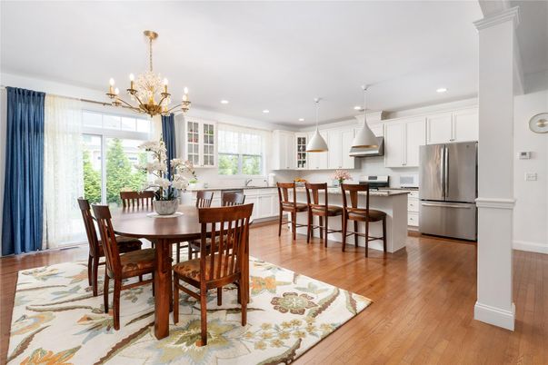 Chandelier, Dining room, Interior, Kitchen, Pendant Lights, Recessed Lighting, Stainless Steel Appliances, Wood Texture Flooring