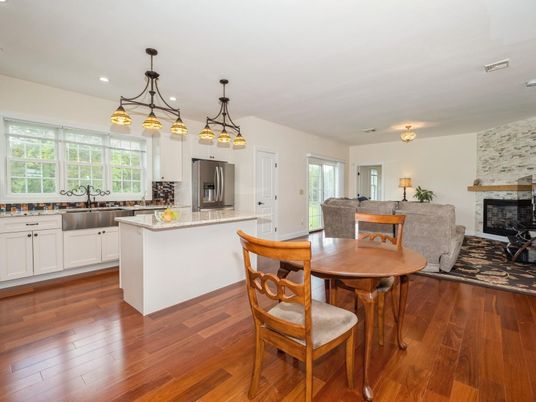 Dining room, Fireplace, Interior, Kitchen, Pendant Lights, Recessed Lighting, Stainless Steel Appliances, Stone Walls, Wood Texture Flooring