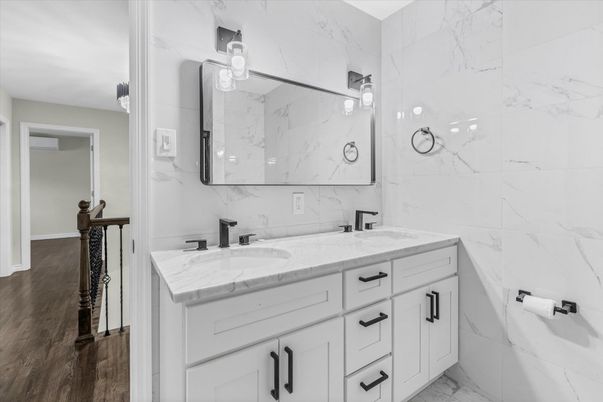 Bathroom, Dual Sink Vanities, Interior, Marble, Marble Walls, Wood Texture Flooring