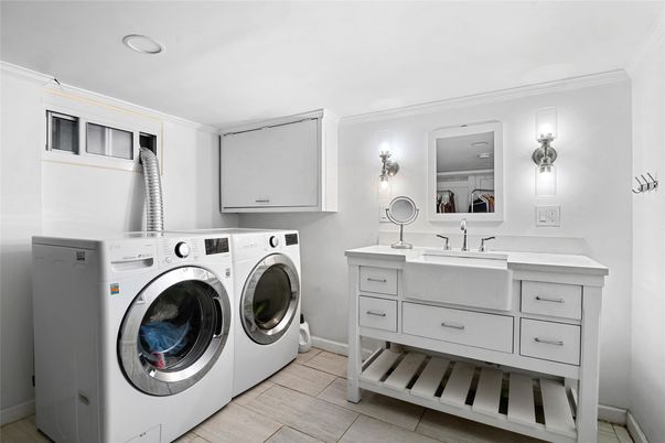 Bathroom, Dual Sink Vanities, Interior, Recessed Lighting, Washer, Wood Texture Flooring