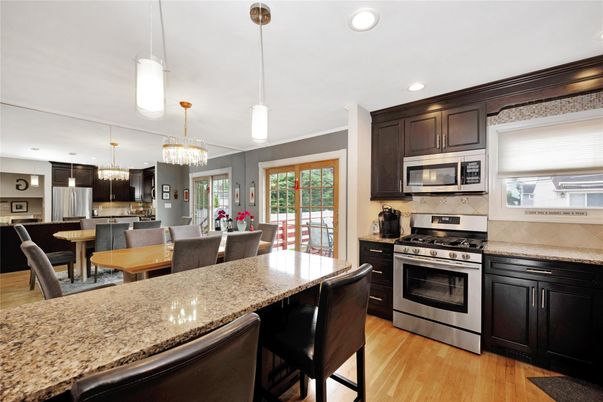 Chandelier, Dining room, Interior, Kitchen, Pendant Lights, Recessed Lighting, Stainless Steel Appliances, Wood Texture Flooring