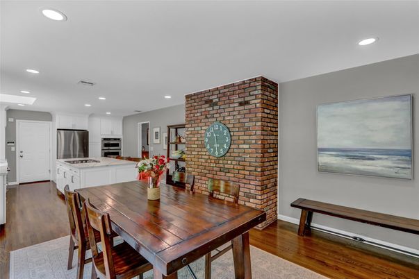 Dining room, Interior, Kitchen, Recessed Lighting, Stainless Steel Appliances, Stone Walls, Wood Texture Flooring