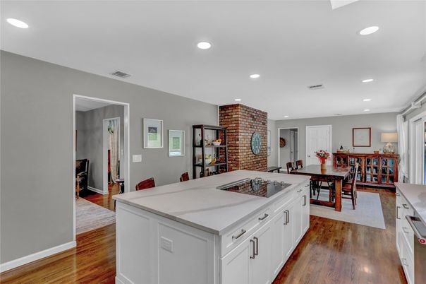 Dining room, Fireplace, Interior, Kitchen, Recessed Lighting, Stone Walls, Wood Texture Flooring