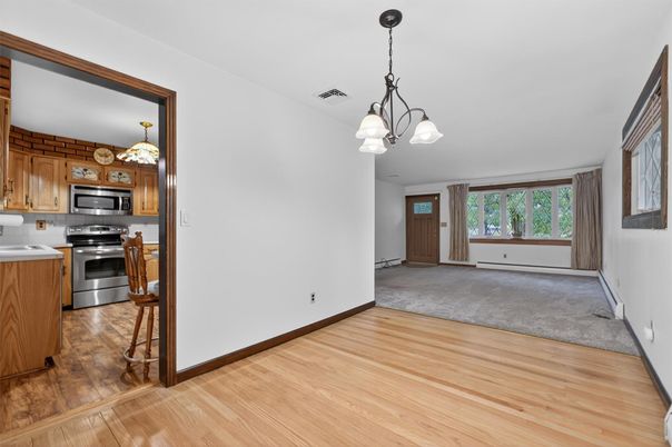 Chandelier, Empty room, Interior, Kitchen, Pendant Lights, Stainless Steel Appliances, Wood Texture Flooring